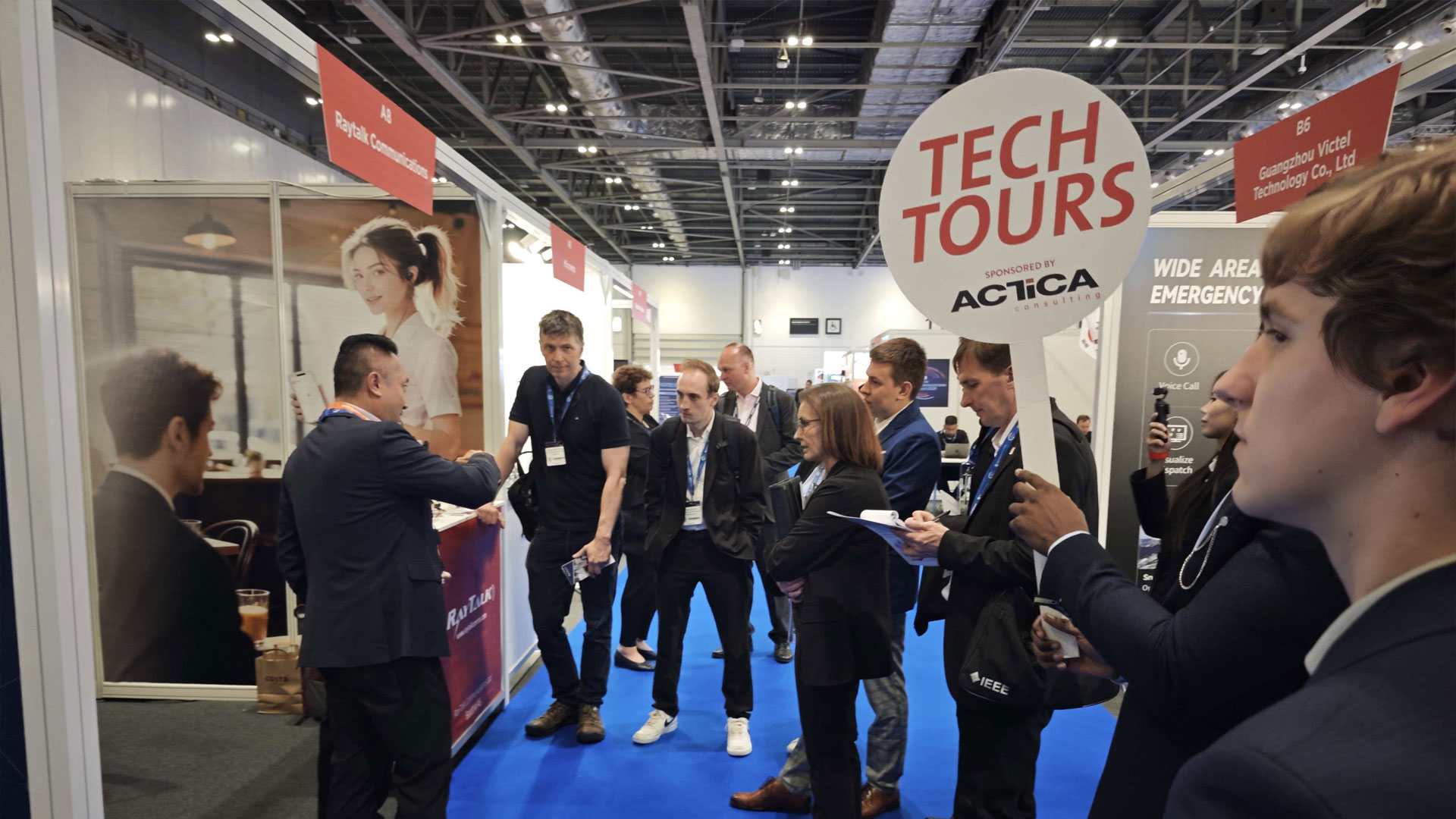 CCW-Tech-Tours-group-exploring-RayTalk-communication-solutions-at-the-booth