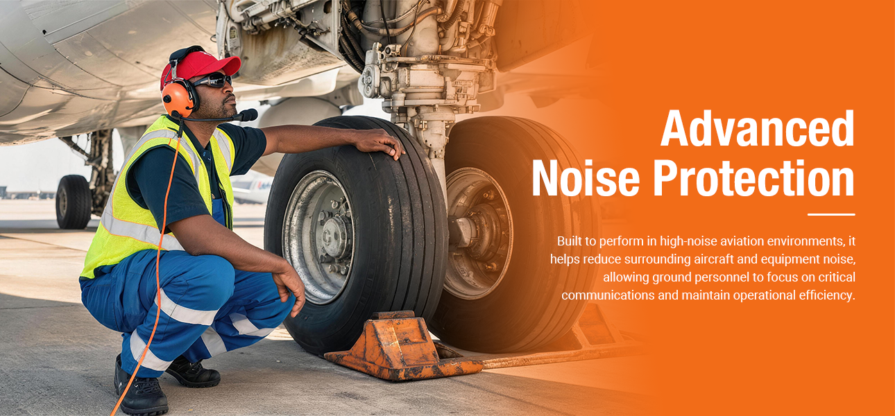 Ramp agent wearing a noise-reducing headset during aircraft tire inspection on the ramp.