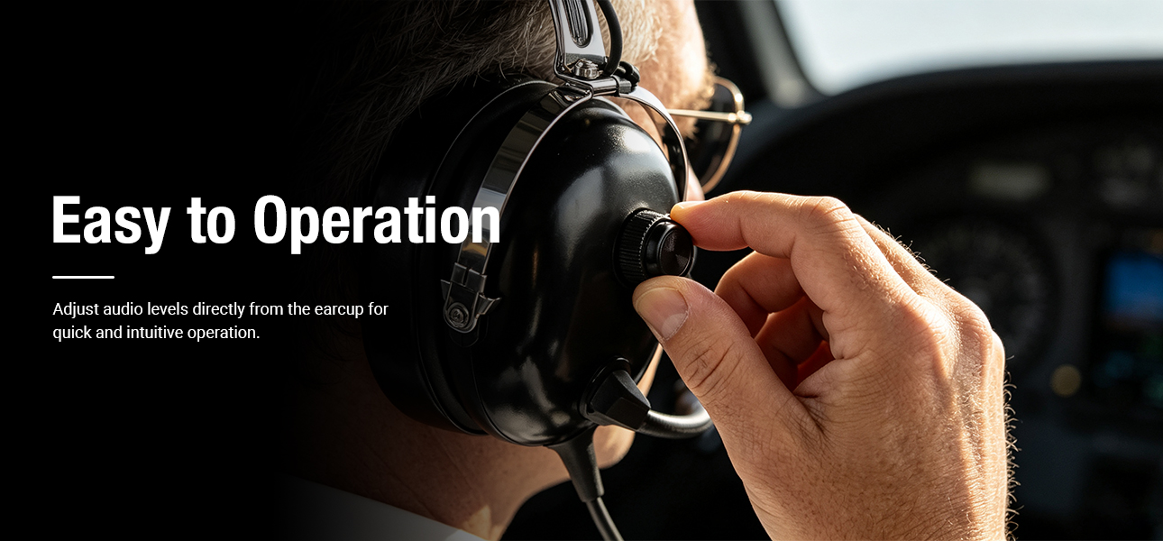 Student pilot adjusting the earcup volume control on an aviation headset during flight