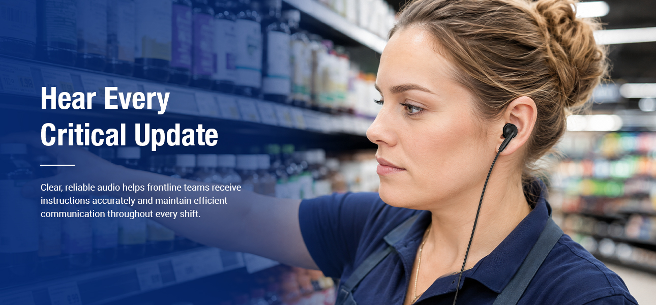 Supermarket staff wearing cover earbud earpieces to clearly hear restocking instructions and replenish shelves