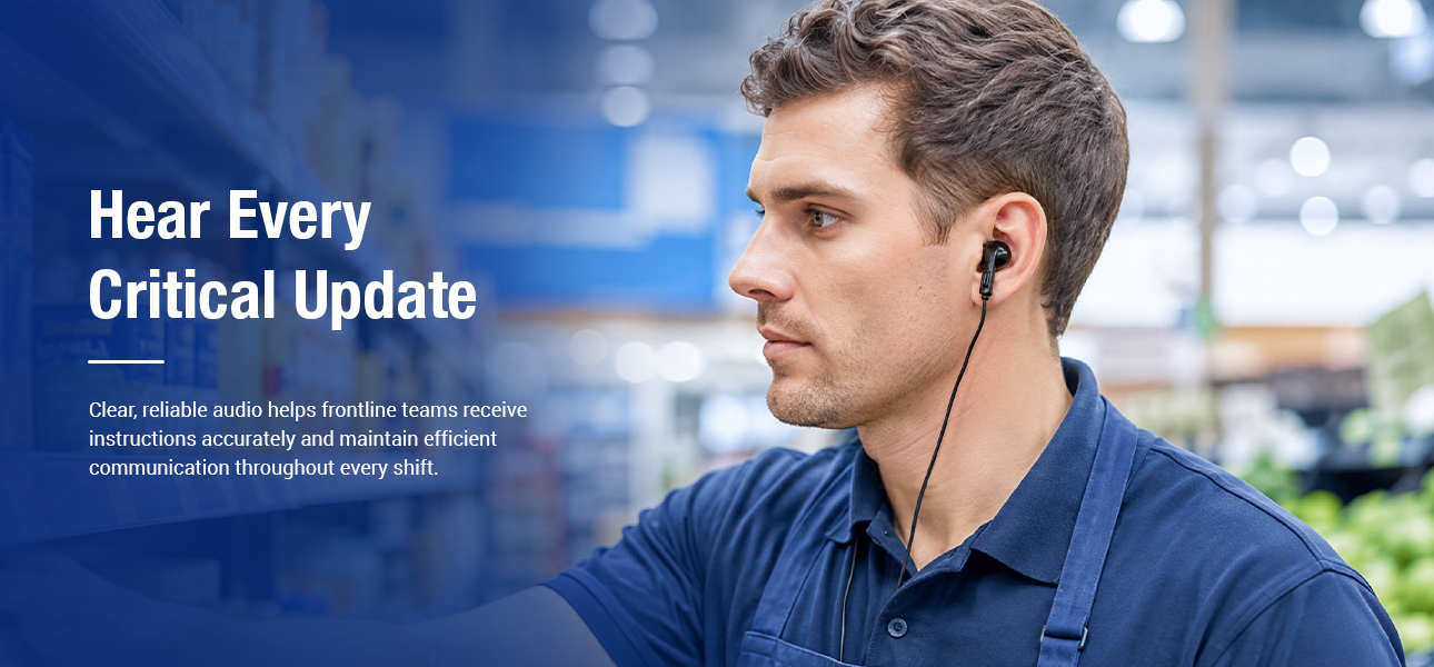 Supermarket staff wearing listen only earpieces to hear instructions while restocking shelves