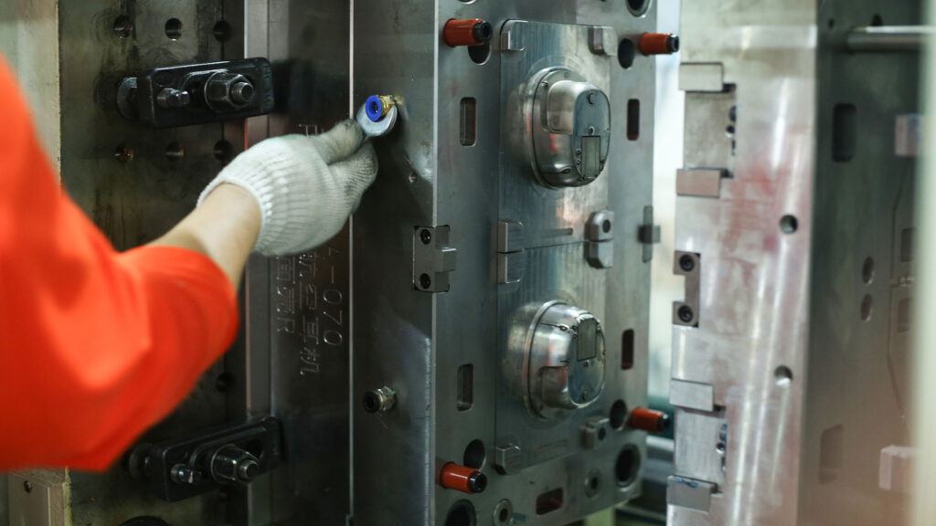 Worker-Adjusting-a-Mold-at-RayTalk’s-Production-and-R&D-Center