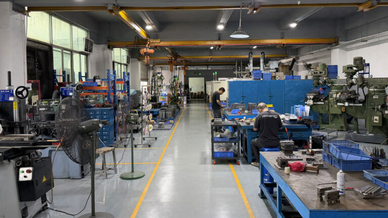 two way radio Communication-Engineer-Adjusting-Molds-and-Production-Equipment-at-RayTalk’s-Production-and-R&D-Center